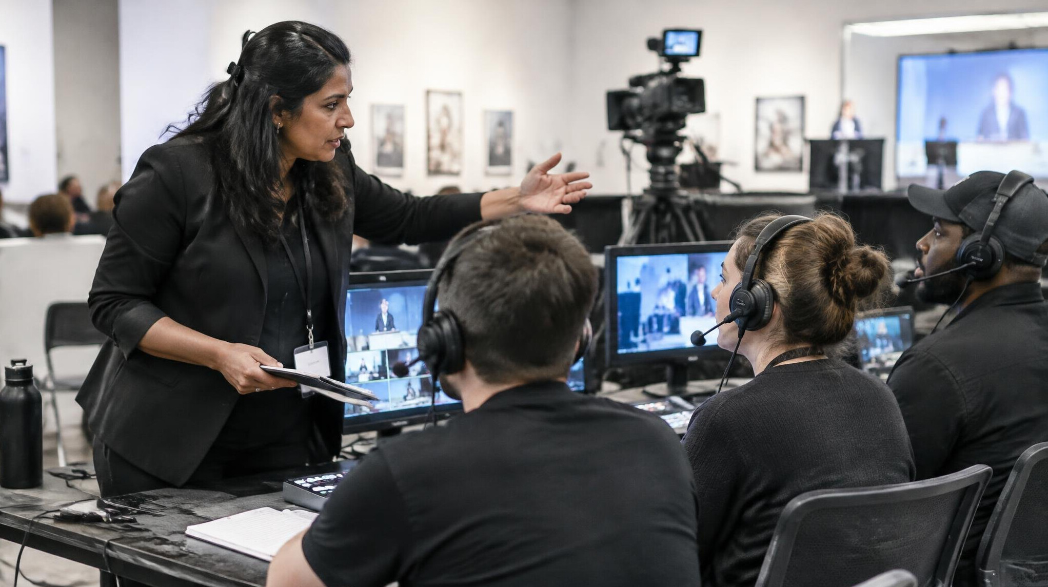 Producer directing a team during a live production
